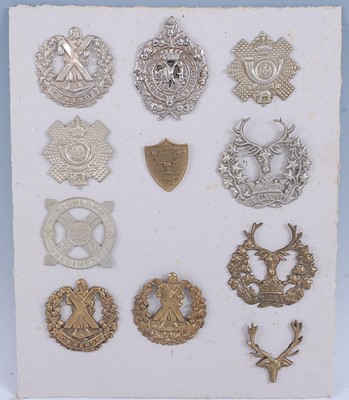 Lot 24 - A collection of glengarry badges to include...
