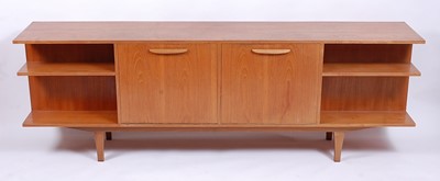 Lot 552 - A 1960s teak long sideboard, having twin...