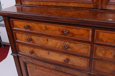 Lot 2521 - A Victorian figured walnut bookcase cabinet in...