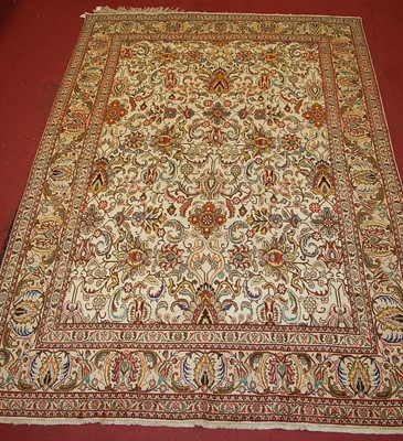 Lot 2448 - A Persian woollen Tabriz carpet, having a...