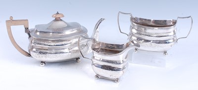 Lot 2112 - A late Georgian silver three-piece tea set,...