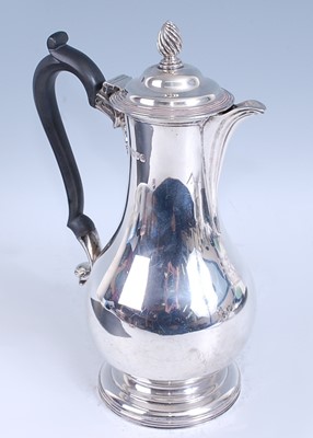 Lot 2136 - An Edwardian silver hot water pot, of slender...