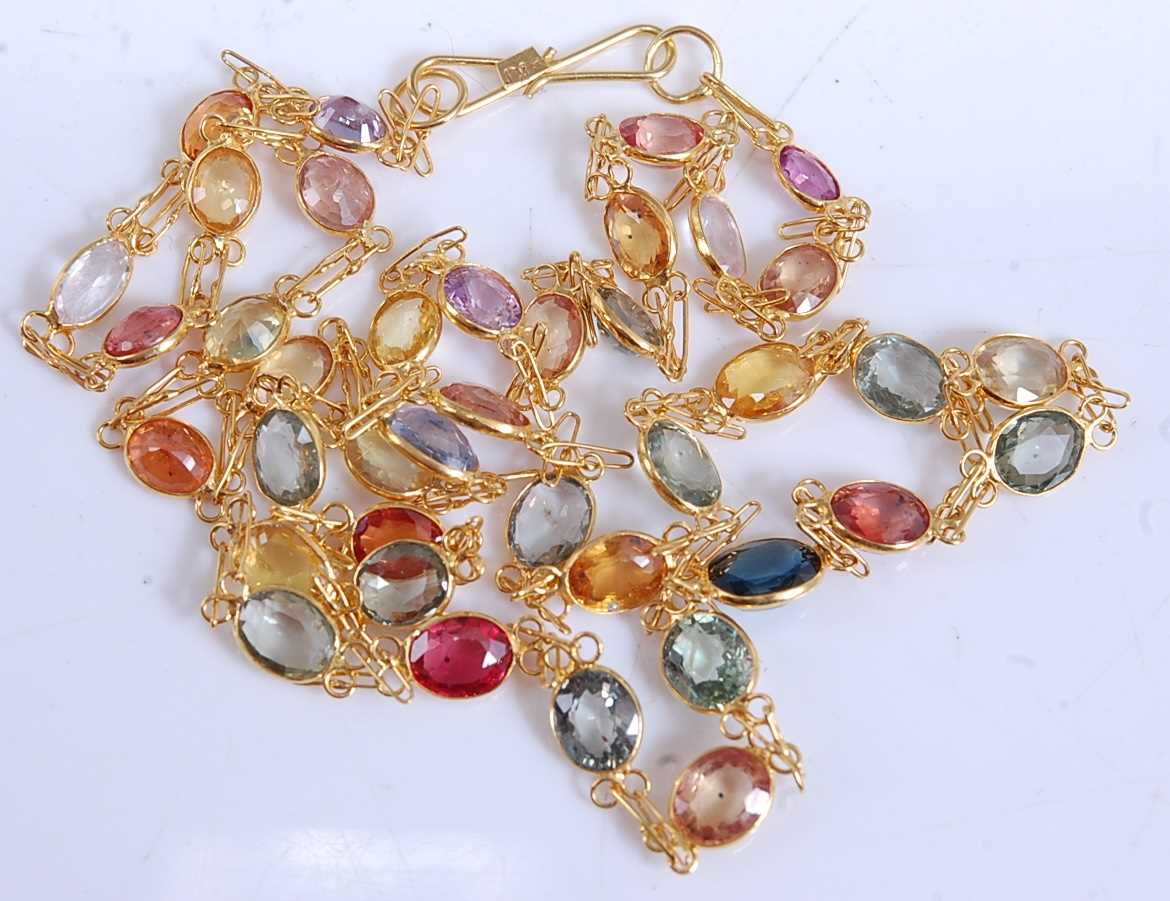 Lot 2517 - A yellow metal multi-sapphire necklace, having...