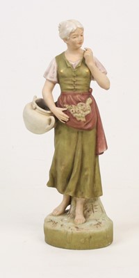 Lot 2 - A Royal Dux porcelain figure of a young woman,...