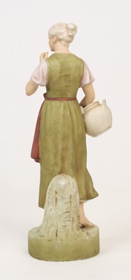 Lot 2 - A Royal Dux porcelain figure of a young woman,...