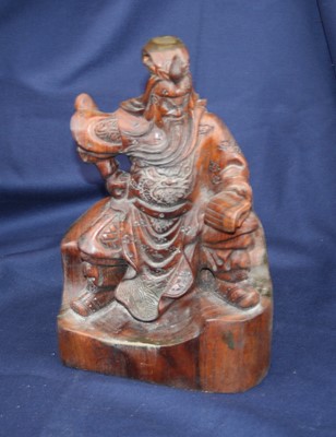 Lot 4 - A 20th century Chinese carved wood figure of a...