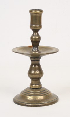 Lot 7 - A 19th century bronze candlestick, standing...