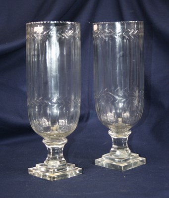 Lot 8 - A pair of modern cut glass hurricane lamps,...