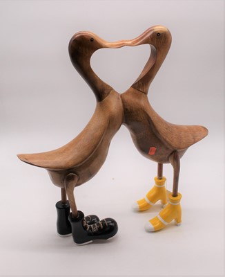 Lot 24 - A pair of modern carved bamboo models of ducks...