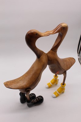 Lot 24 - A pair of modern carved bamboo models of ducks...