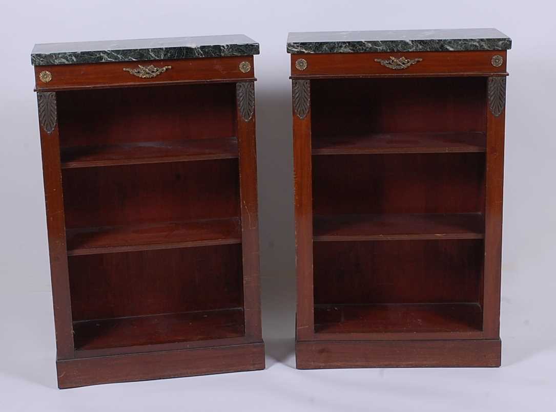 Lot 2466 - A pair of mahogany open bookshelves in the...