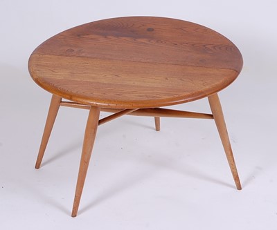 Lot 514 - A 1960s Ercol light elm low single dropflap...