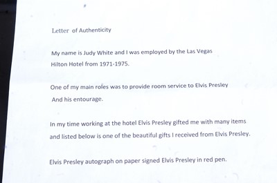 Lot 1178 - Elvis Presley, autograph in pink ink on paper,...