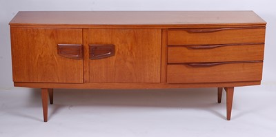 Lot 567 - A 1960s teak long sideboard by Beautility, of...
