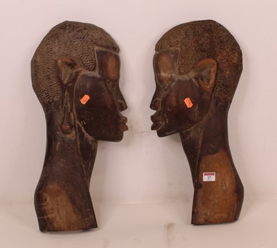 Lot 27 - A pair of 20th century African hardwood...