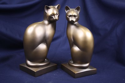 Lot 32 - A pair of composition models of cats, height 28cm