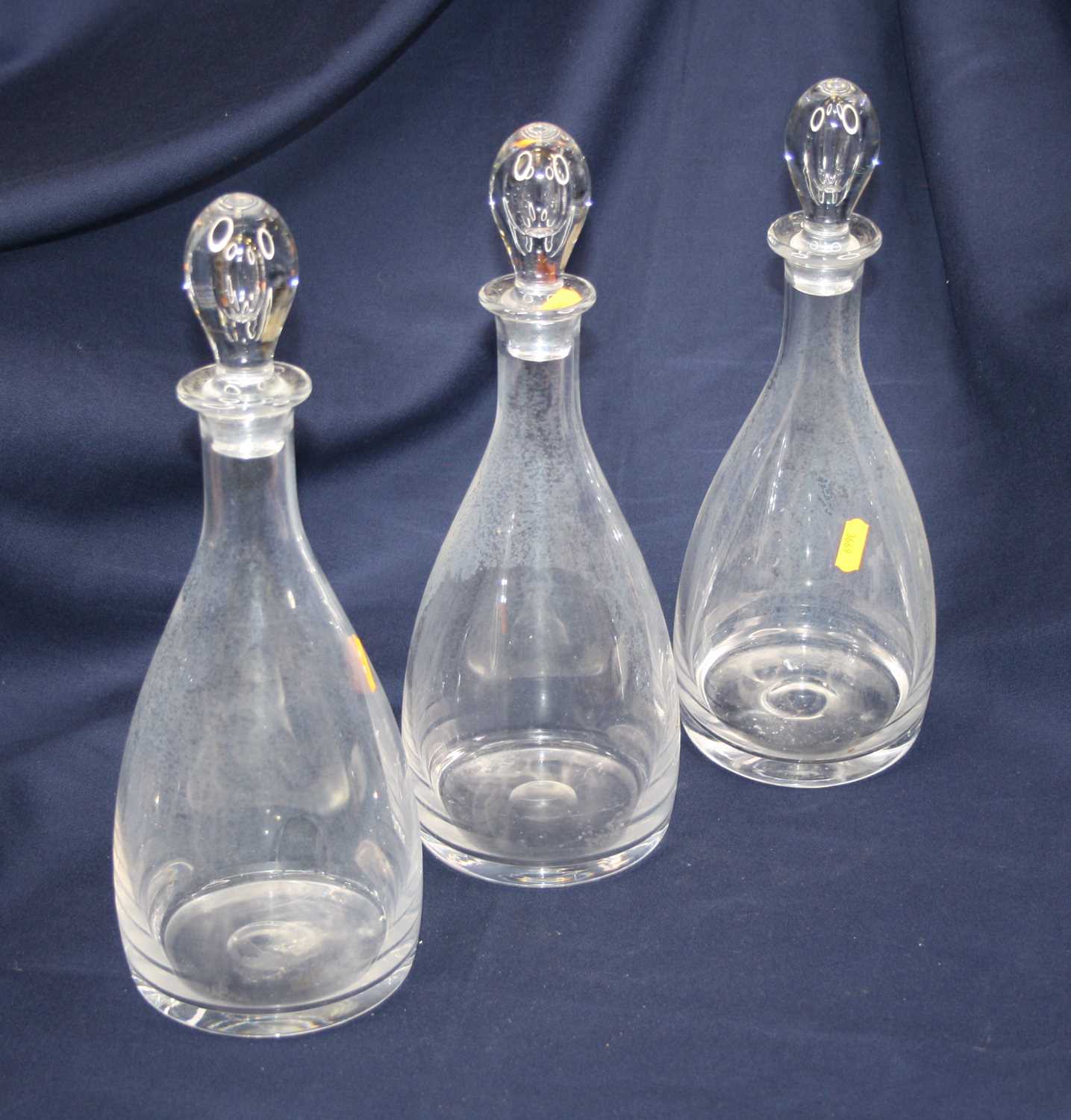 Lot 36 - A set of three 20th century glass decanters,...