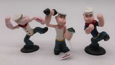 Lot 40 - A set of three painted cast iron figures of...