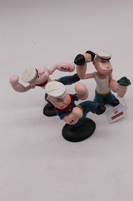 Lot 40 - A set of three painted cast iron figures of...