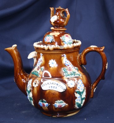 Lot 50 - An early 20th century bargeware teapot...