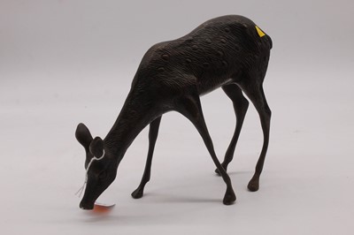 Lot 55 - A 20th century bronze model of a fawn, height...