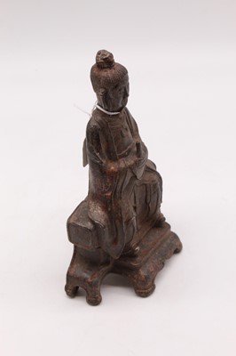 Lot 70 - A Chinese cast metal figure of a seated...