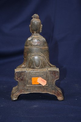 Lot 70 - A Chinese cast metal figure of a seated...