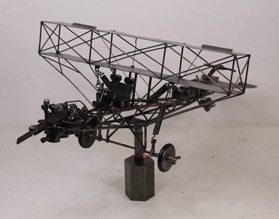 Lot 107 - A 20th century sculpture of a bi-plane,...