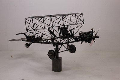 Lot 107 - A 20th century sculpture of a bi-plane,...