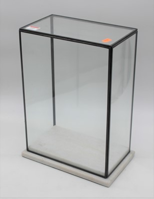 Lot 165 - A glazed display case, mounted upon a polished...