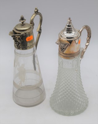 Lot 172 - Two silver plated mounted glass claret jugs,...