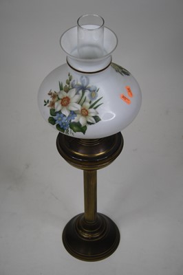 Lot 127 - A late Victorian brass oil lamp with floral...