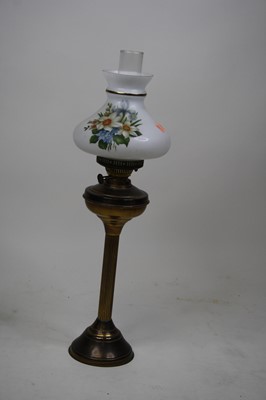Lot 127 - A late Victorian brass oil lamp with floral...