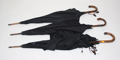 Lot 131 - A Victorian black parasol, the handle with...