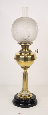 Lot 132 - A late 19th century brass oil lamp inscribed...