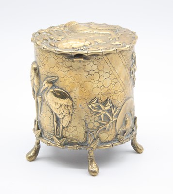 Lot 257 - A Japanese brass lidded jar, relief decorated...