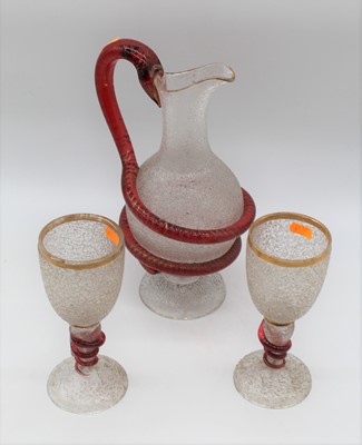 Lot 267 - A moulded glass ewer, the handle in the form...