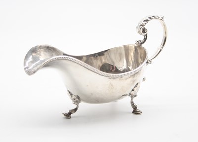 Lot 394 - An Edwardian silver sauce boat of typical form...
