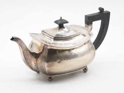 Lot 395 - An Ewardian silver teapot of squat rectangular...