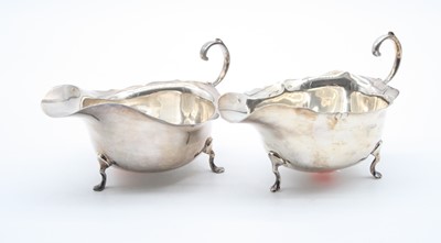 Lot 404 - A near pair of 20th century silver sauce boats,...