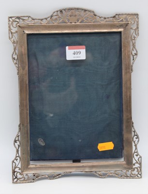 Lot 409 - A George V silver clad easel photo frame of...