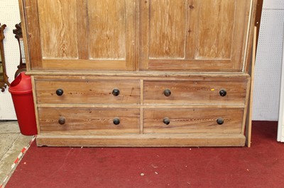 Lot 1170 - A large rustic pine housekeeper's cupboard,...