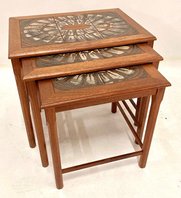 Lot 569 - A 1960s Danish teak and tile-top inset nest of...