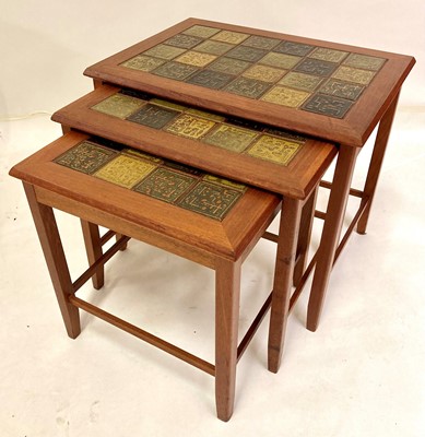 Lot 570 - A 1960s Danish teak and tile-top inset nest of...