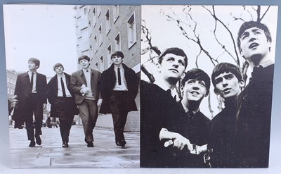 Lot 1205 - The Beatles, a pair of canvas prints each...