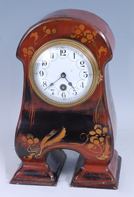 Lot 312 - An Art Nouveau lacquered wood mantel clock,...