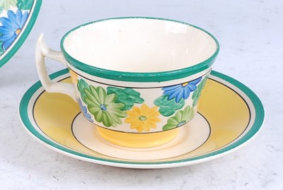 Lot 122 - A 1930s Clarice Cliff Sungay pattern tea-trio,...