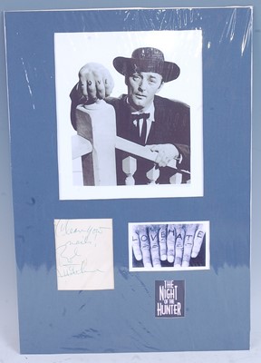 Lot 1201 - Robert Mitchum, (1917-1997), a 20 x 18cm black...