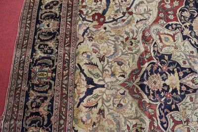 Lot 1380 - A Persian woollen Isfahan carpet, the central...