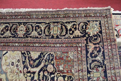 Lot 1380 - A Persian woollen Isfahan carpet, the central...